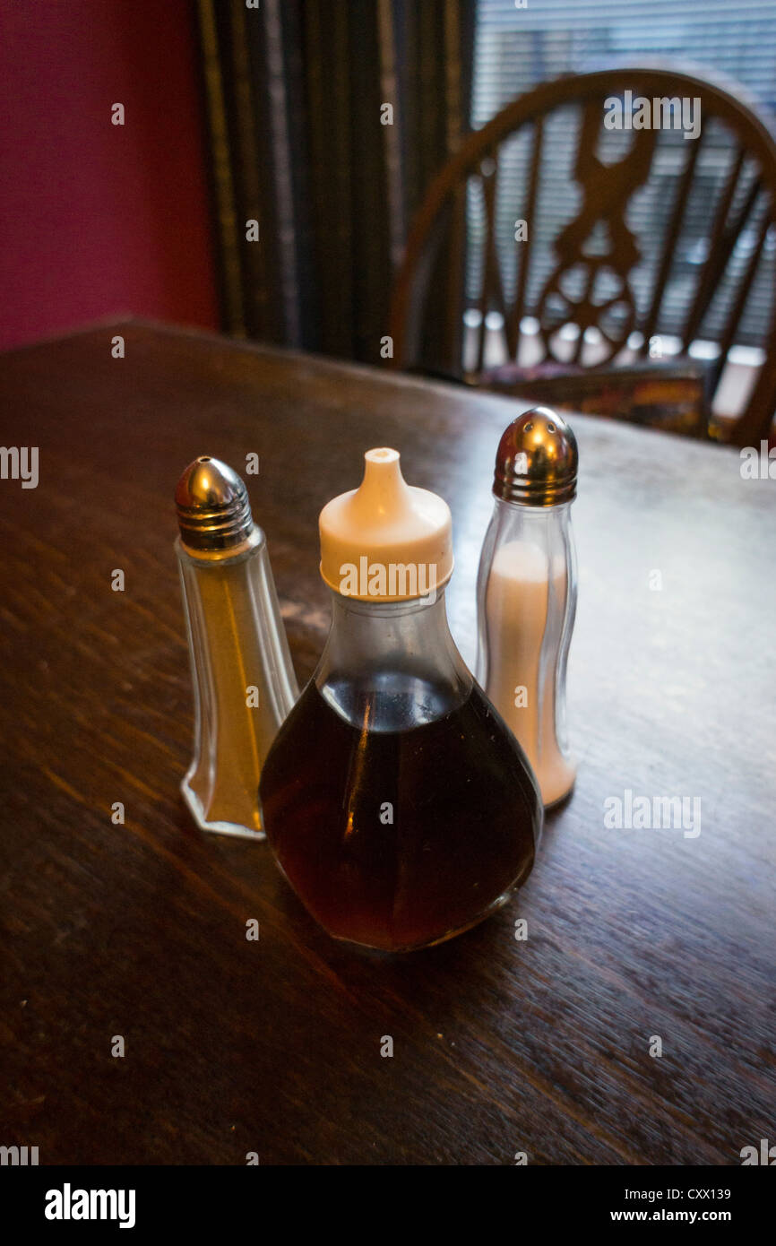 Condiments set on a restaurant / pub table Stock Photo