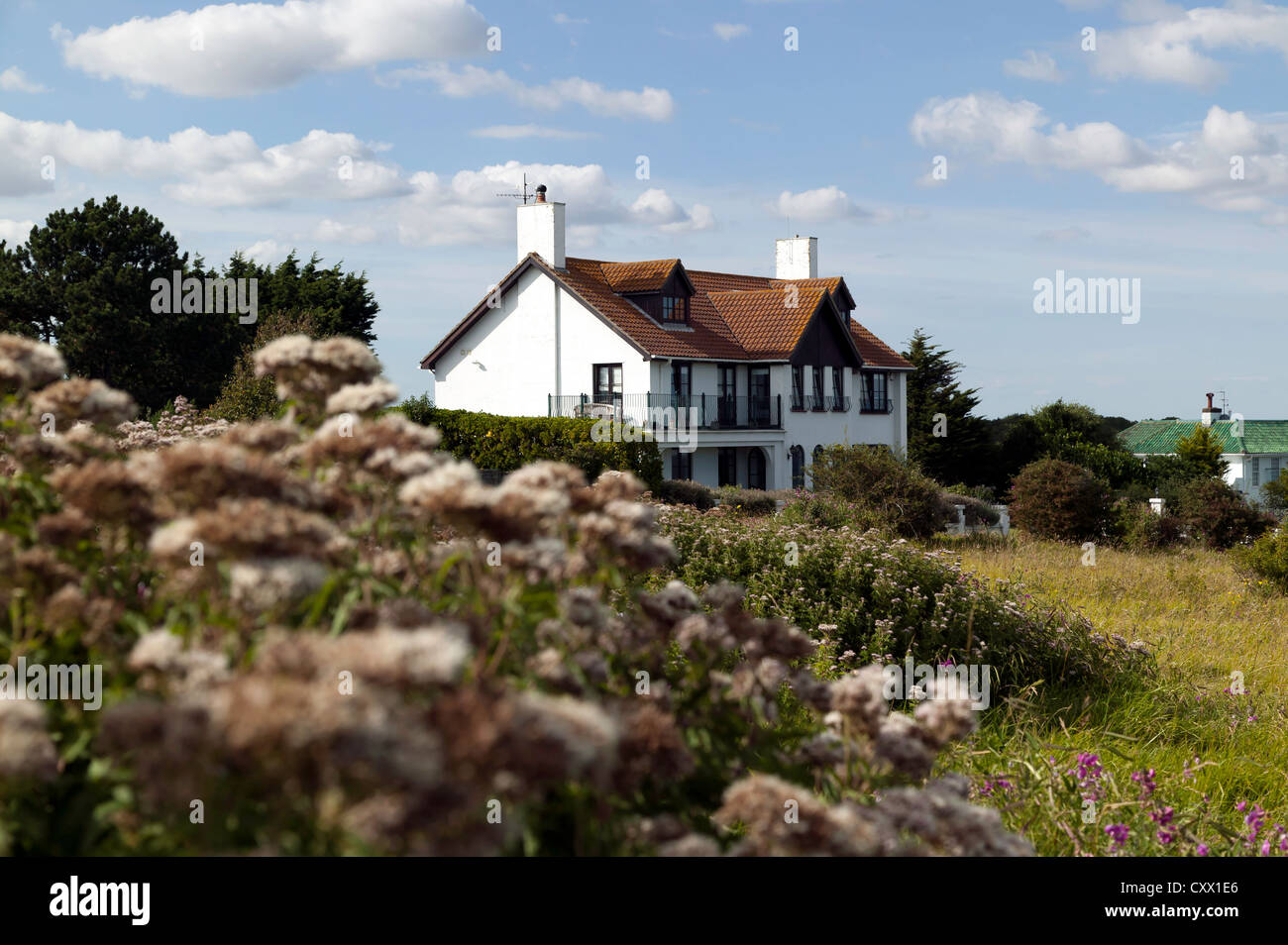 Cliff-top house viewed from near Oldstairs Bay, at the start of the clifftop  section of the Saxon Shore Way, Kent. Stock Photo