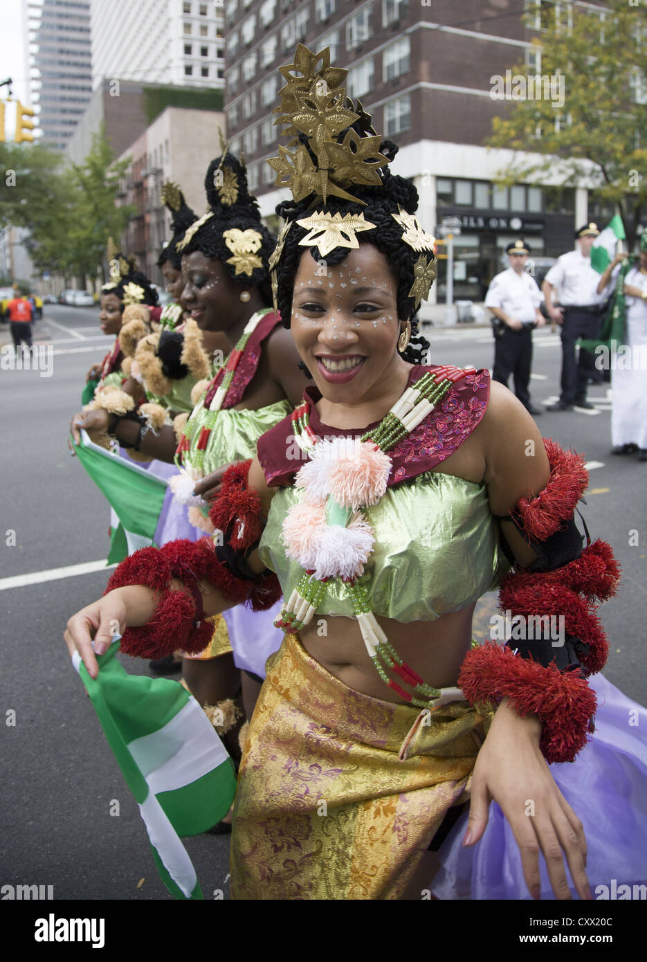 Dance group in cultural outfits from the Akwa Ibom state of Nigeria perform in the Nigerian Independence Day Parade, NYC Stock Photo