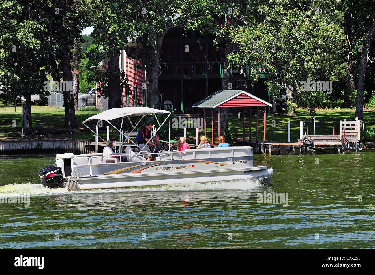 Pontoon boat with mixed group of people cruising the Fox River in