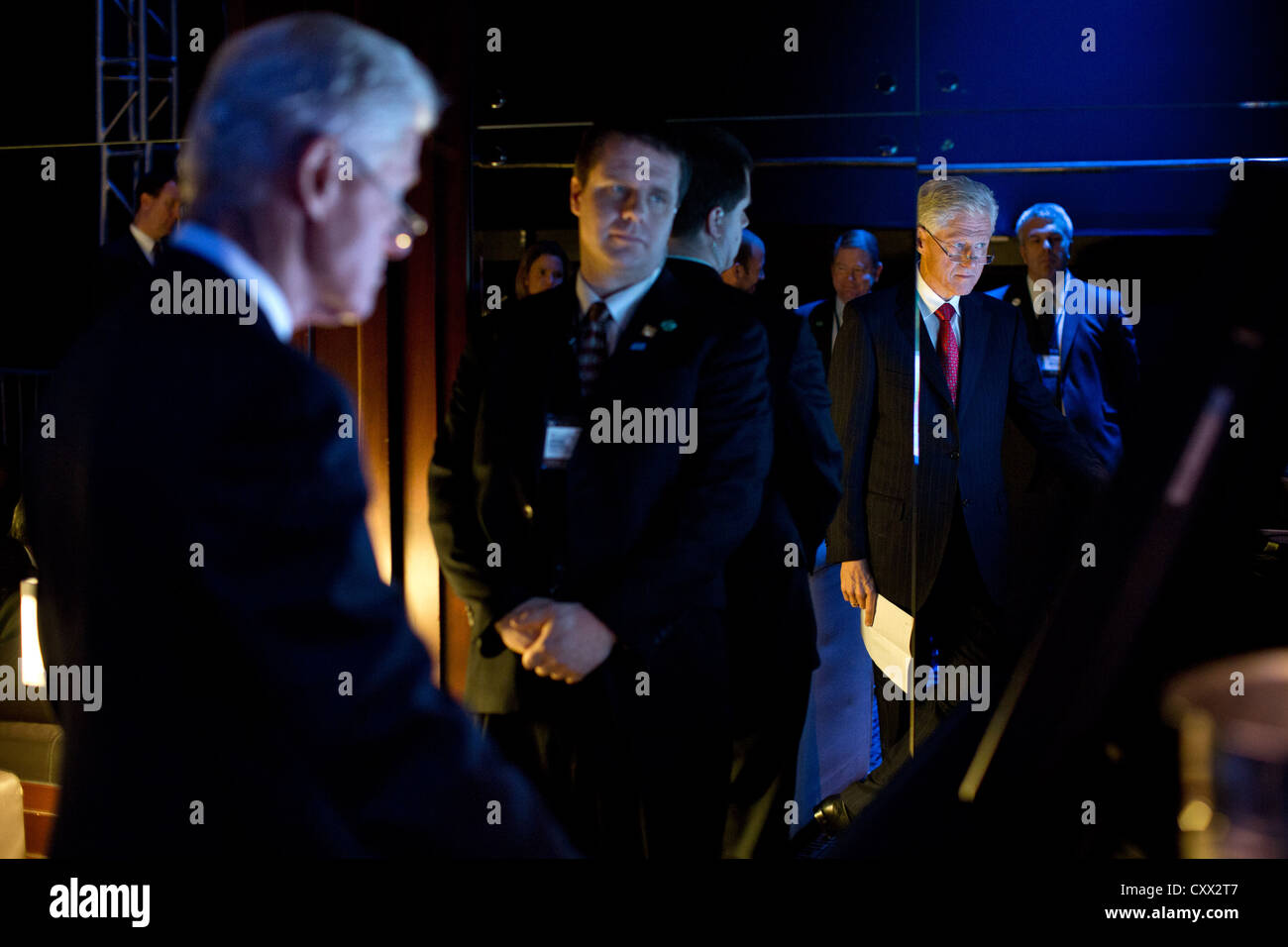 Former President Bill Clinton watches from backstage as President Barack Obama delivers remarks at the Clinton Global Initiative annual meeting at the Sheraton New York Hotel and Towers September 25, 2012 in New York. Stock Photo