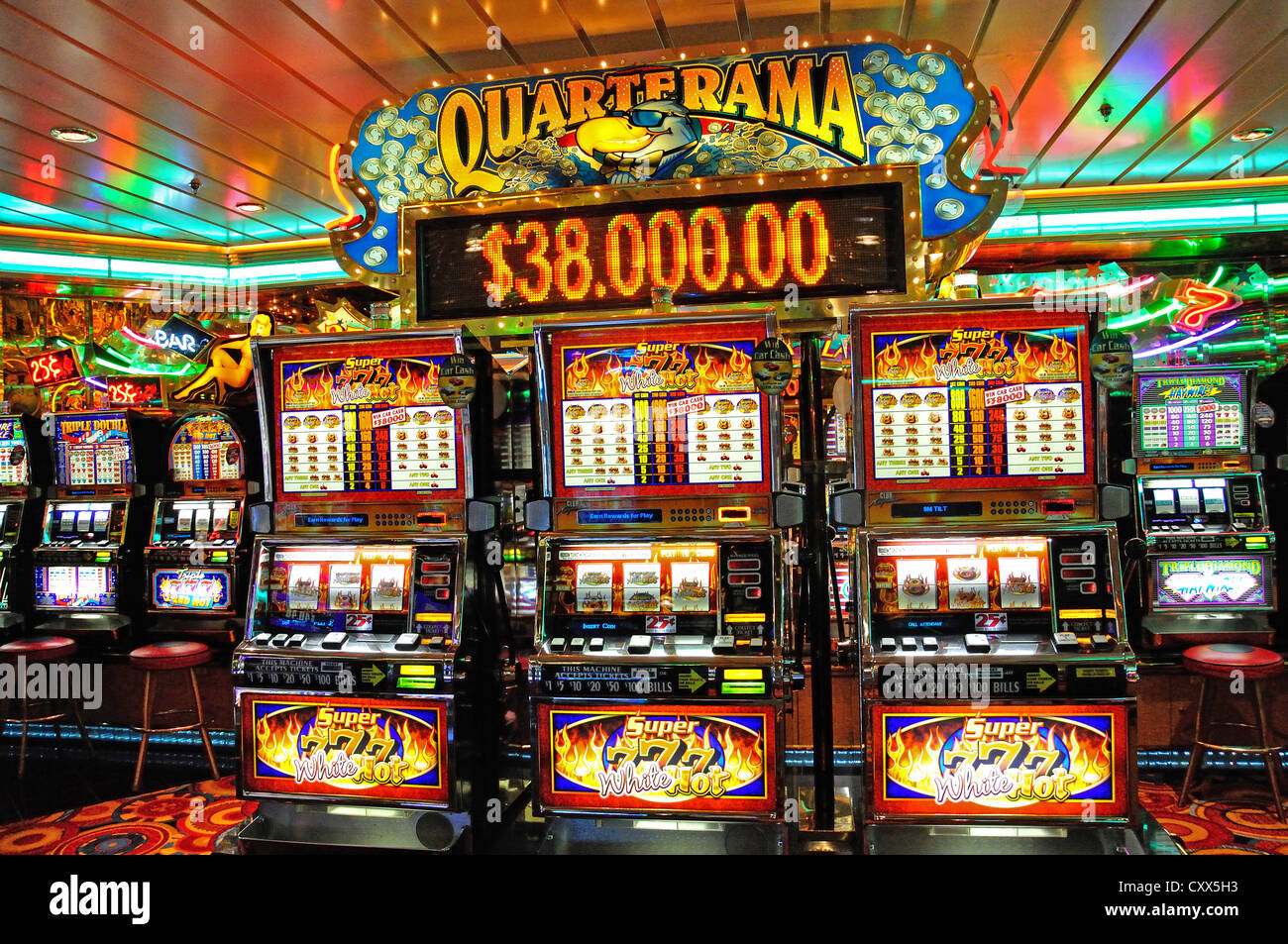 Slot machines in casino on board Royal Caribbean 'Grandeur of the Seas' cruise ship, Mediterranean, Europe Stock Photo