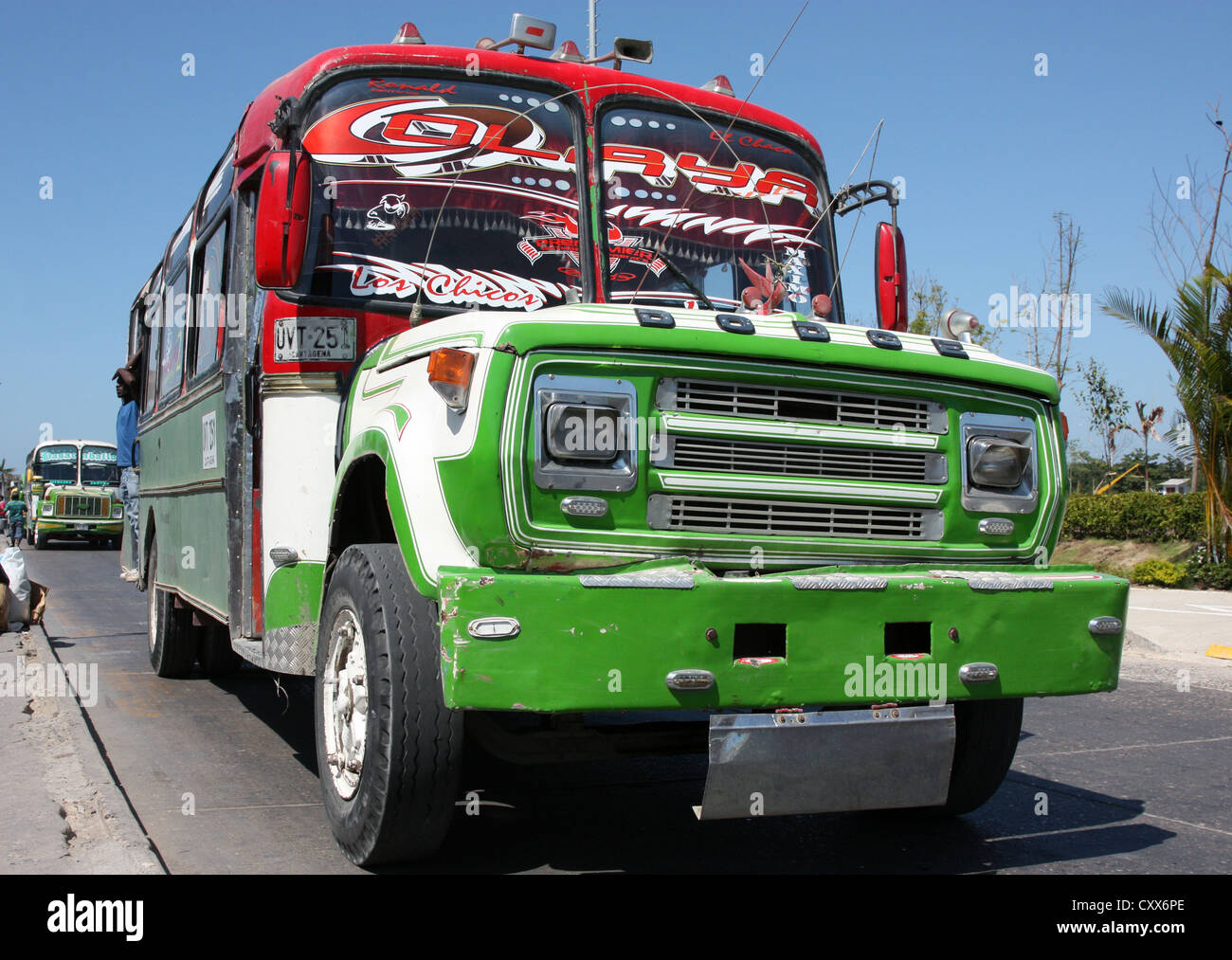 Brightly decorated local bus picking up passengers in Old City, Cartagena, Colombia, South America Stock Photo