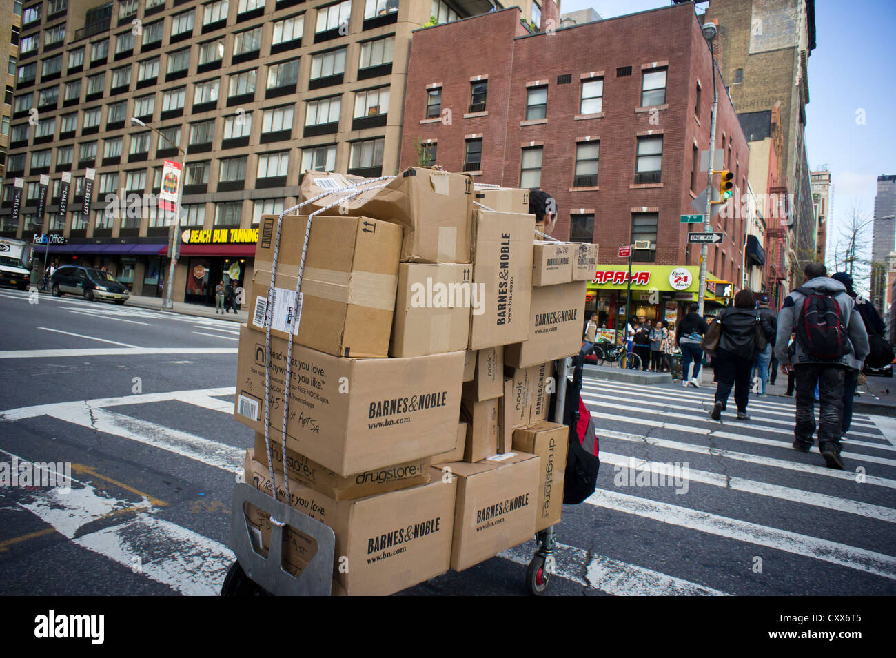 A Courier Transports Packages For Delivery From Barnes Noble And Other Companies In New York Stock Photo Alamy