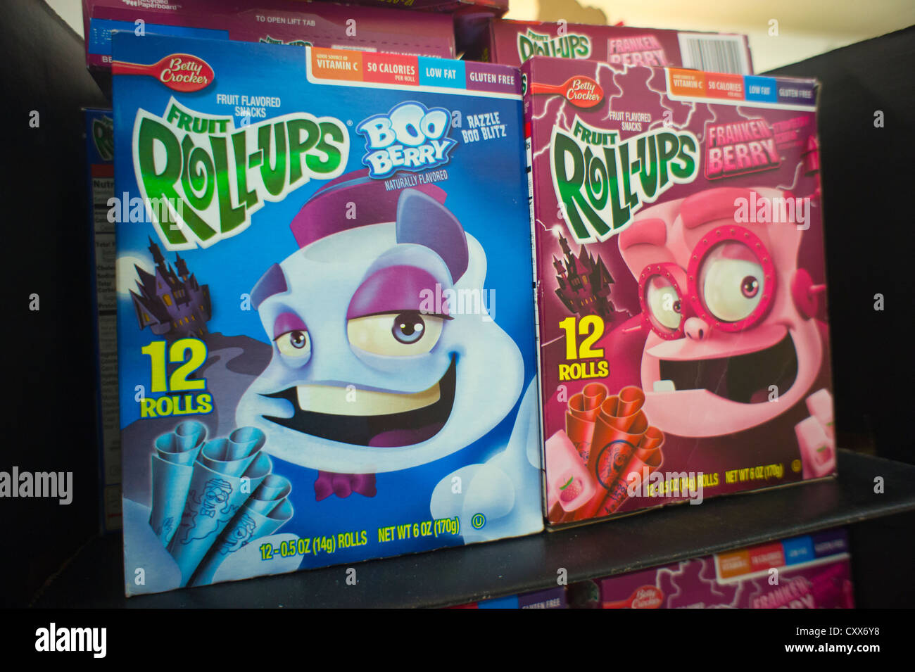 Boxes of General Mills Roll-ups featuring cartoon characters Frankenberry and Booberry on supermarket shelves Stock Photo