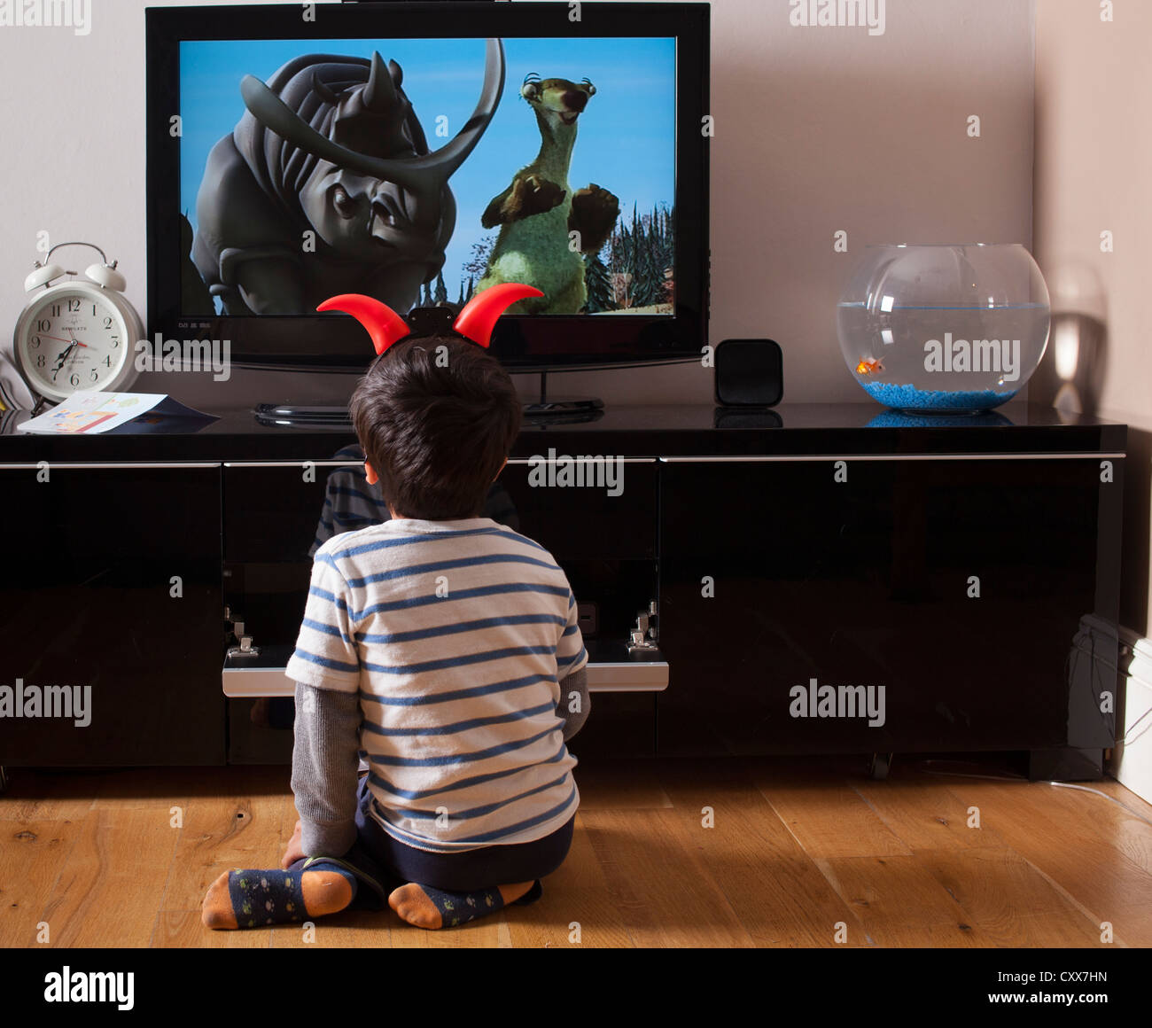 Child watches TV Stock Photo