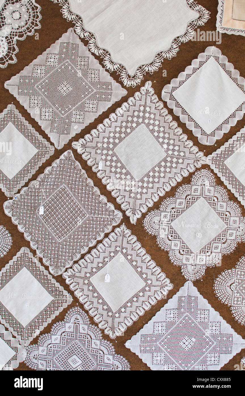 Hand made fine lace squares in a variety of intricate designs from the specialist lace makers of Camariñas, Galicia, Spain Stock Photo