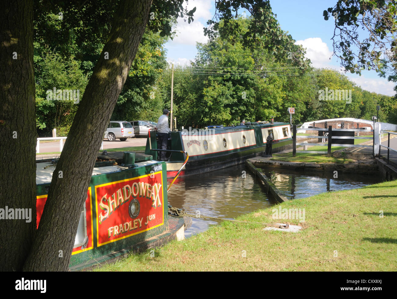 58' narrowboat 'Padworth' enters Keeper's Lock (No. 16) on the Trent & Mersey Canal at Fradley Junction, Staffordshire, England Stock Photo