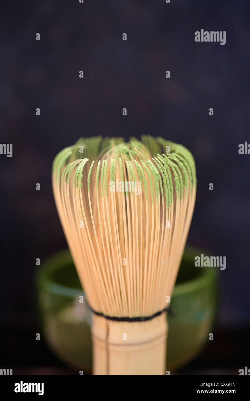 Tea whisk with matcha green tea powder Stock Photo Alamy