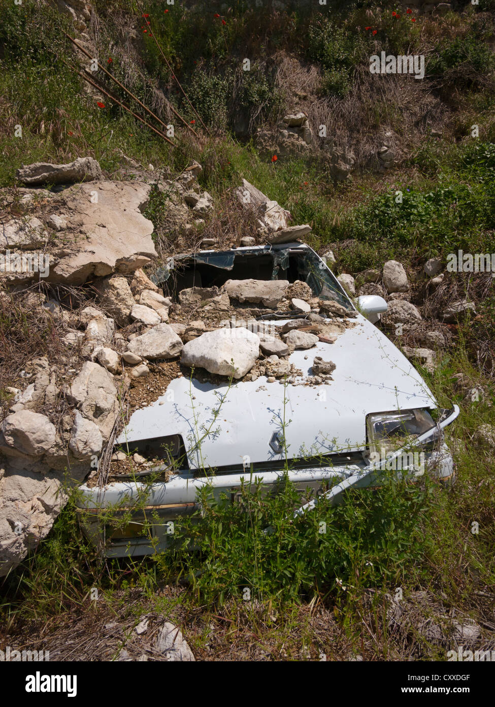 Smashed car, destroyed by the earthquake on 6th April 2009 in Castelnuovo near L'Aquila, Abruzzo region, Italy, Europe Stock Photo
