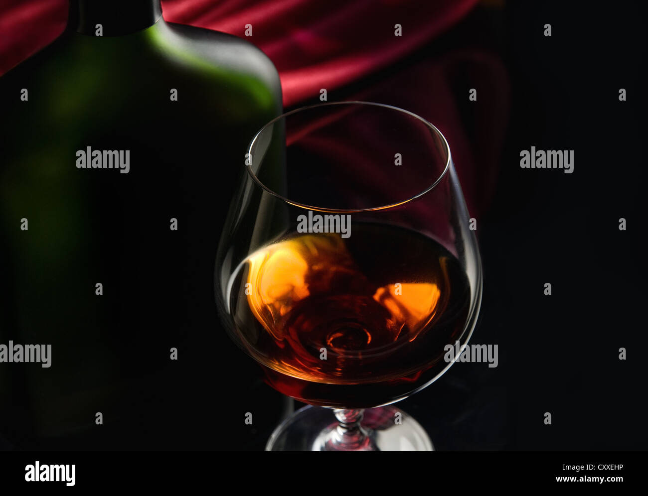 Brandy glass and bottle Stock Photo Alamy