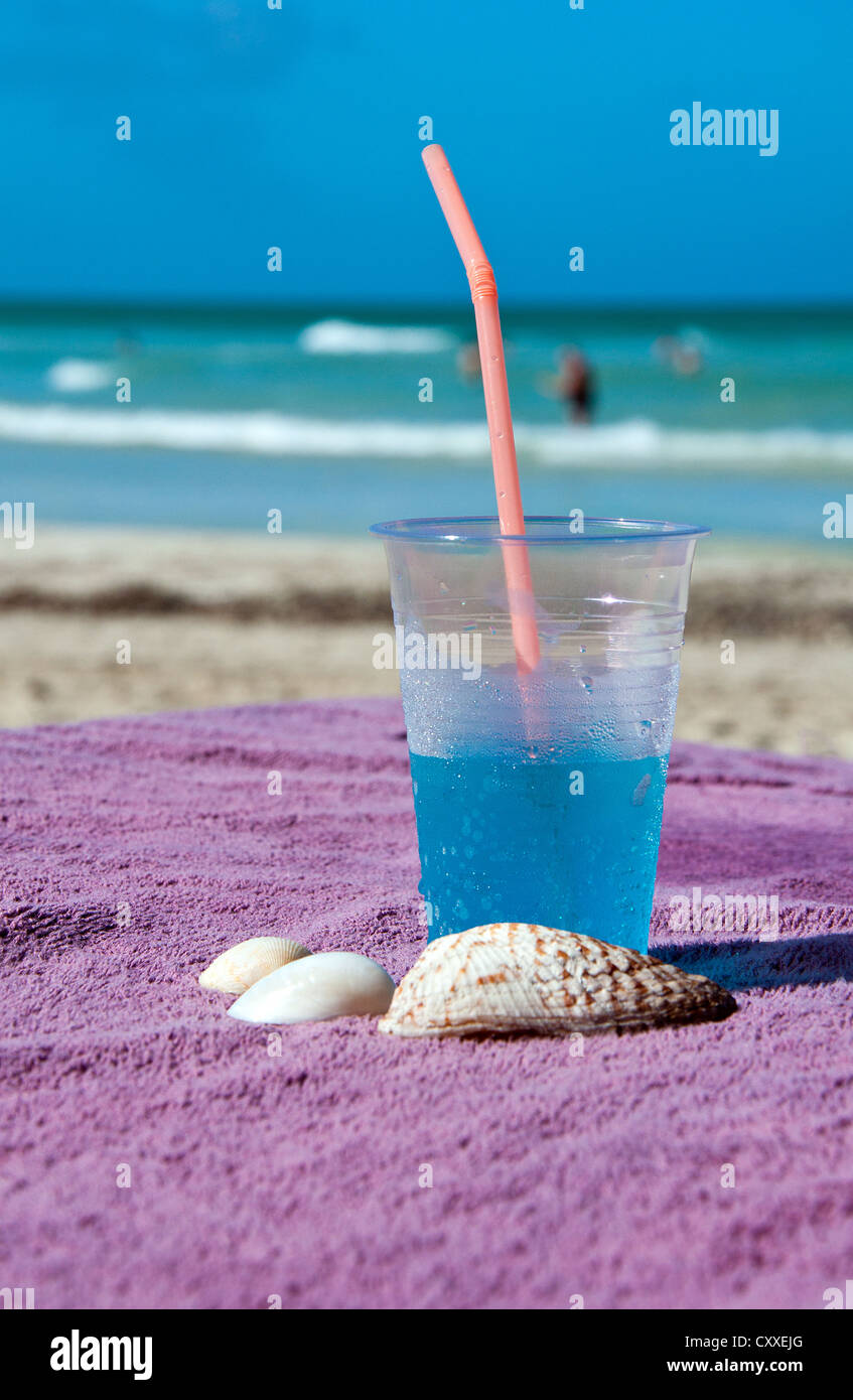 Blue tropical drink on the Caribbean beach Stock Photo - Alamy