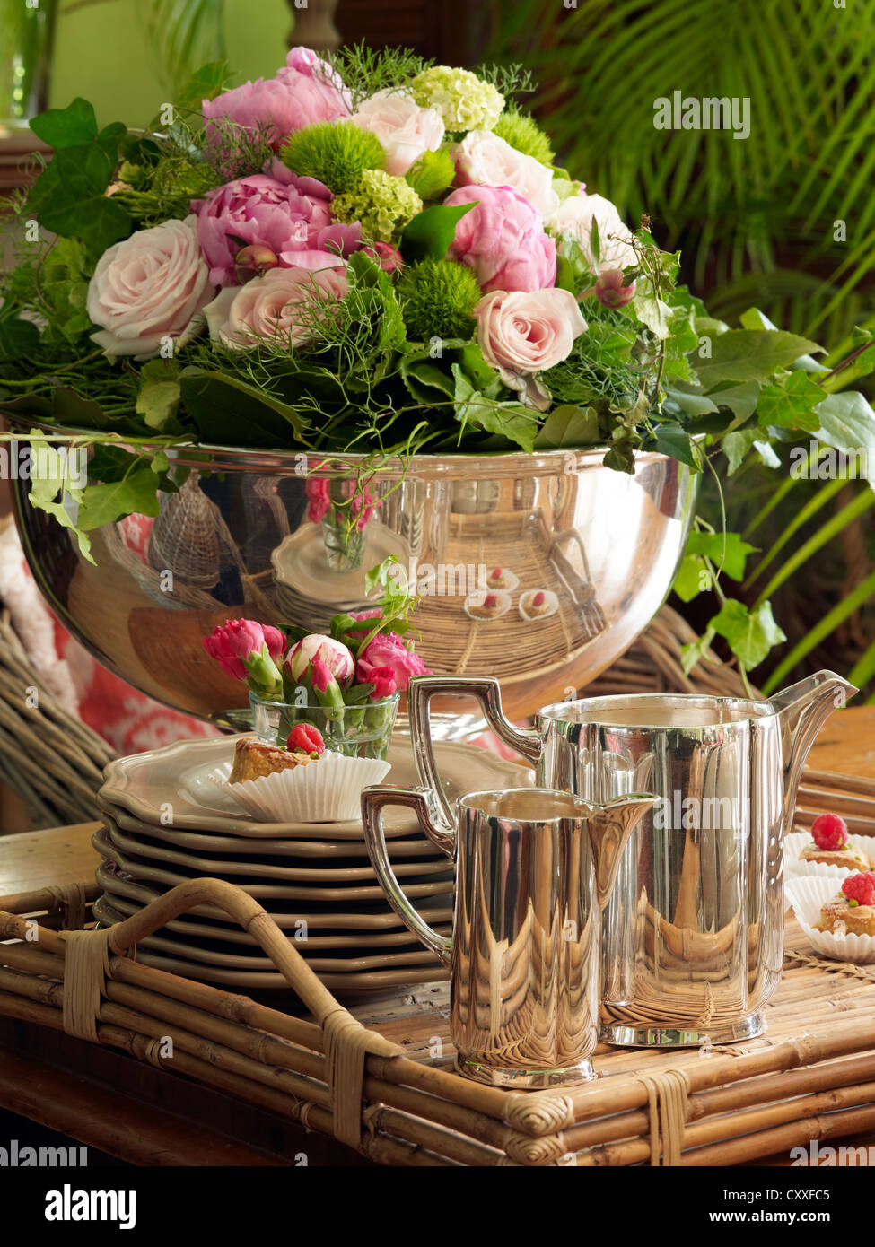 Stylish silver coffee table accessories on a tray in a romantic setting Stock Photo