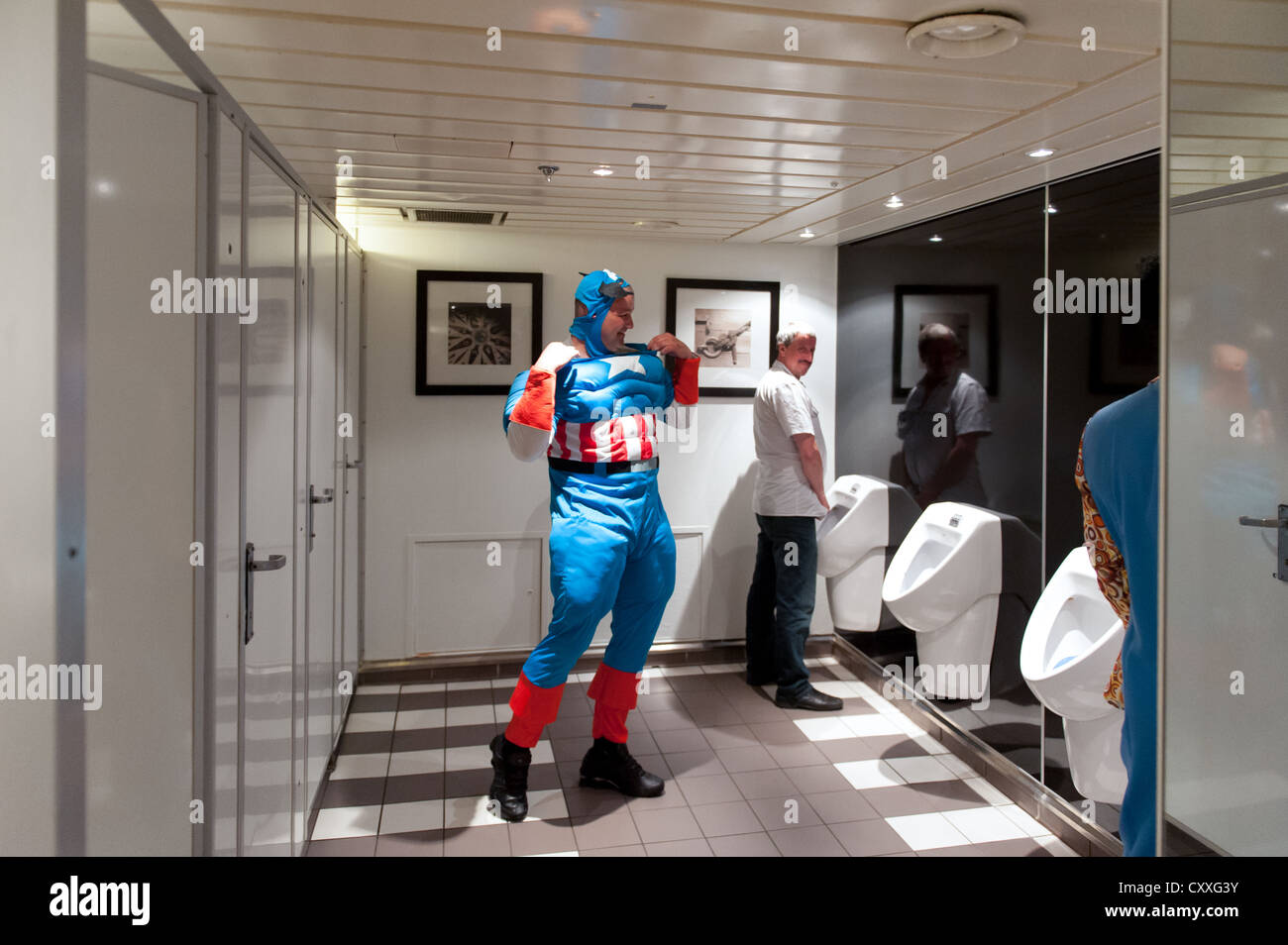 Captain America checking his clothes in a men's toilet Stock Photo - Alamy