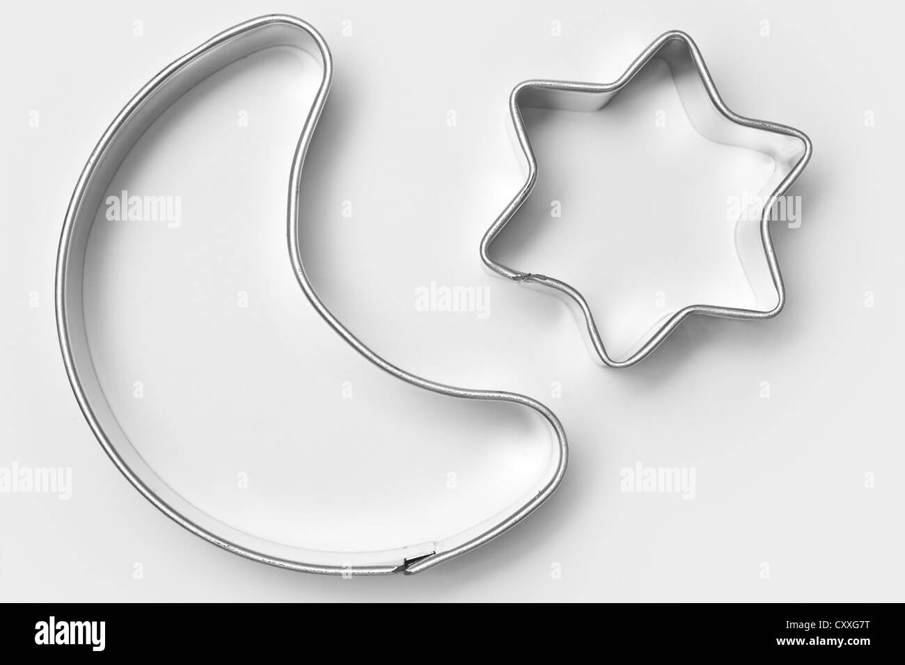 Moon and star-shaped cookie cutters for Christmas cookies Stock Photo