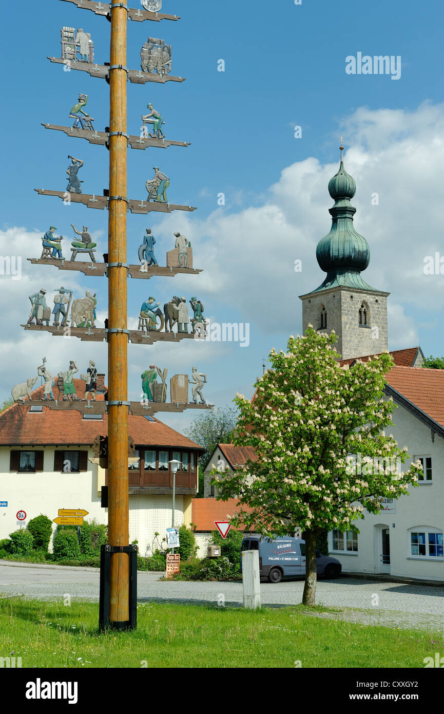 May pole in front of the St. John the Baptist parish church, Tyrlaching, Upper Bavaria Stock Photo