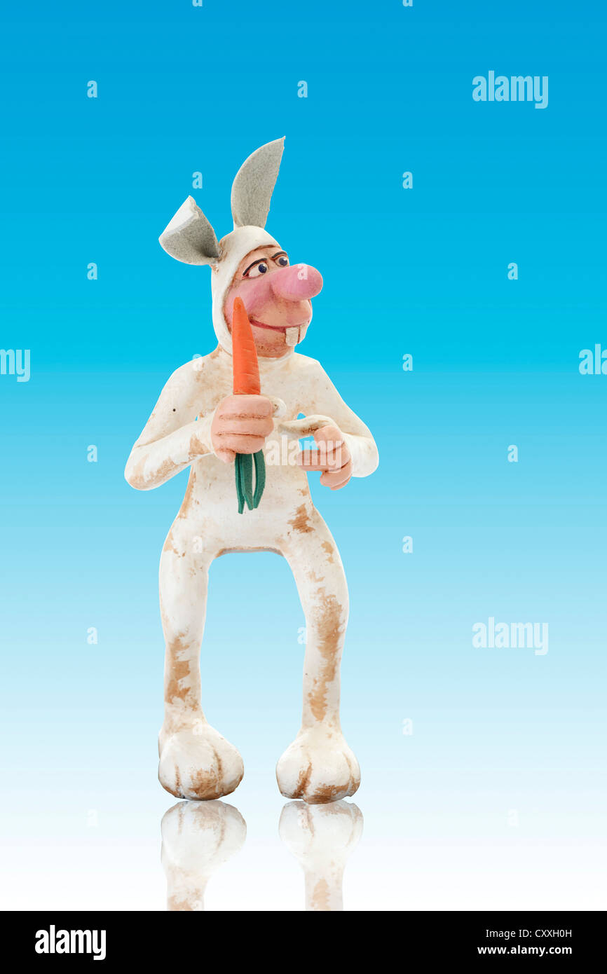 Cartoon character, bunny holding a carrot Stock Photo