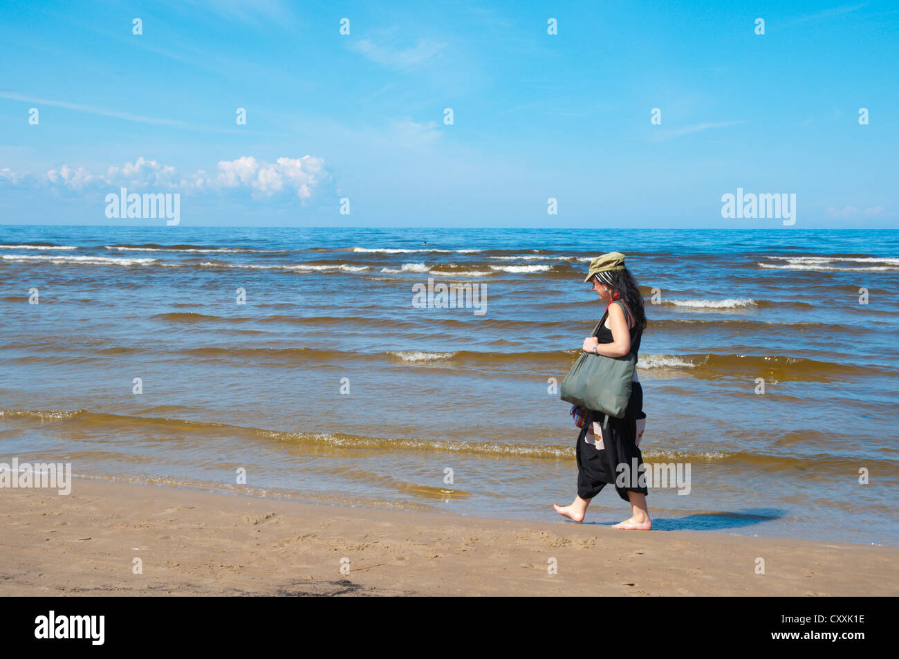 Female in her early 30s walking on beach at Jurmala beach resort near Riga Latvia Europe Stock Photo
