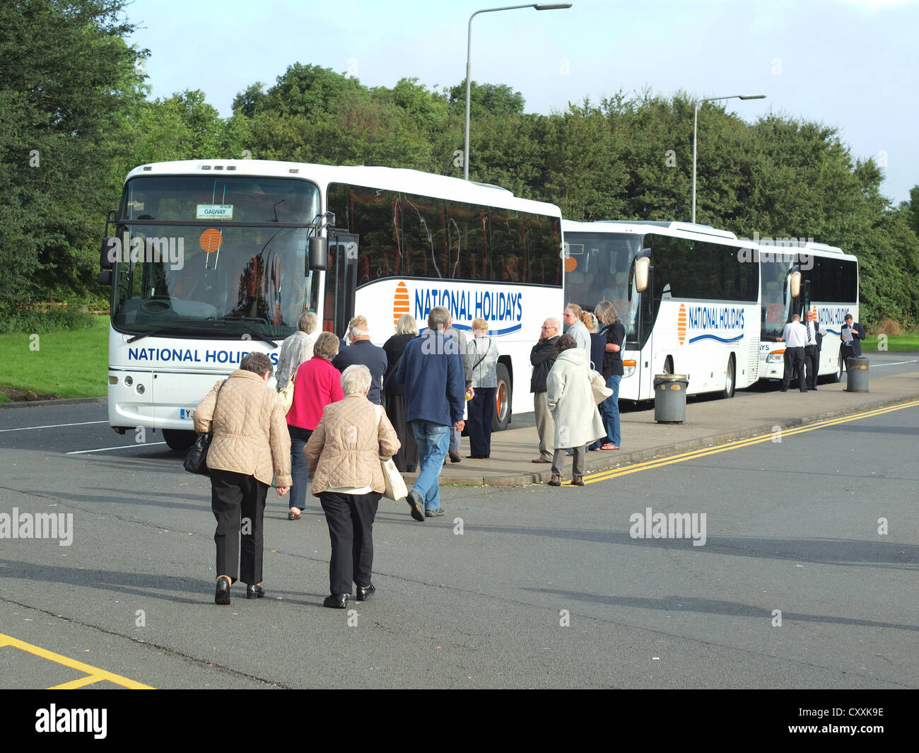 Three National Express Tour buses picking-up passengers at Blyth-Services in Yorkshire for an onward Journey bound to Ireland. Stock Photo