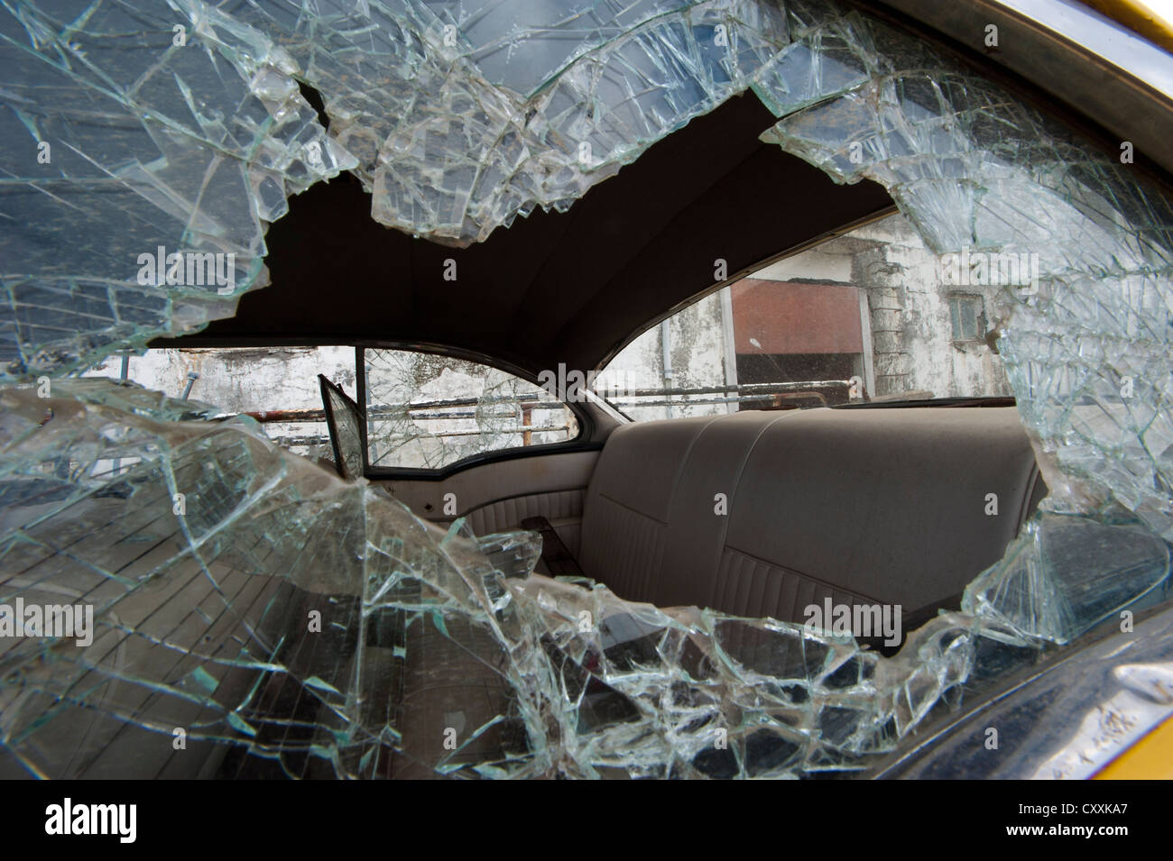 Smashed car window, town of Djúpavík, Reykjarfjoerður fjord, Strandir, Westfjords, Iceland, Europe Stock Photo