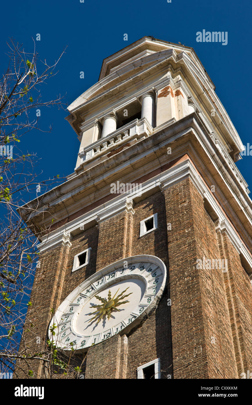 Bell Tower of Santi Apostoli Church with 24-Hour Clock, Venice, Italy Stock Photo