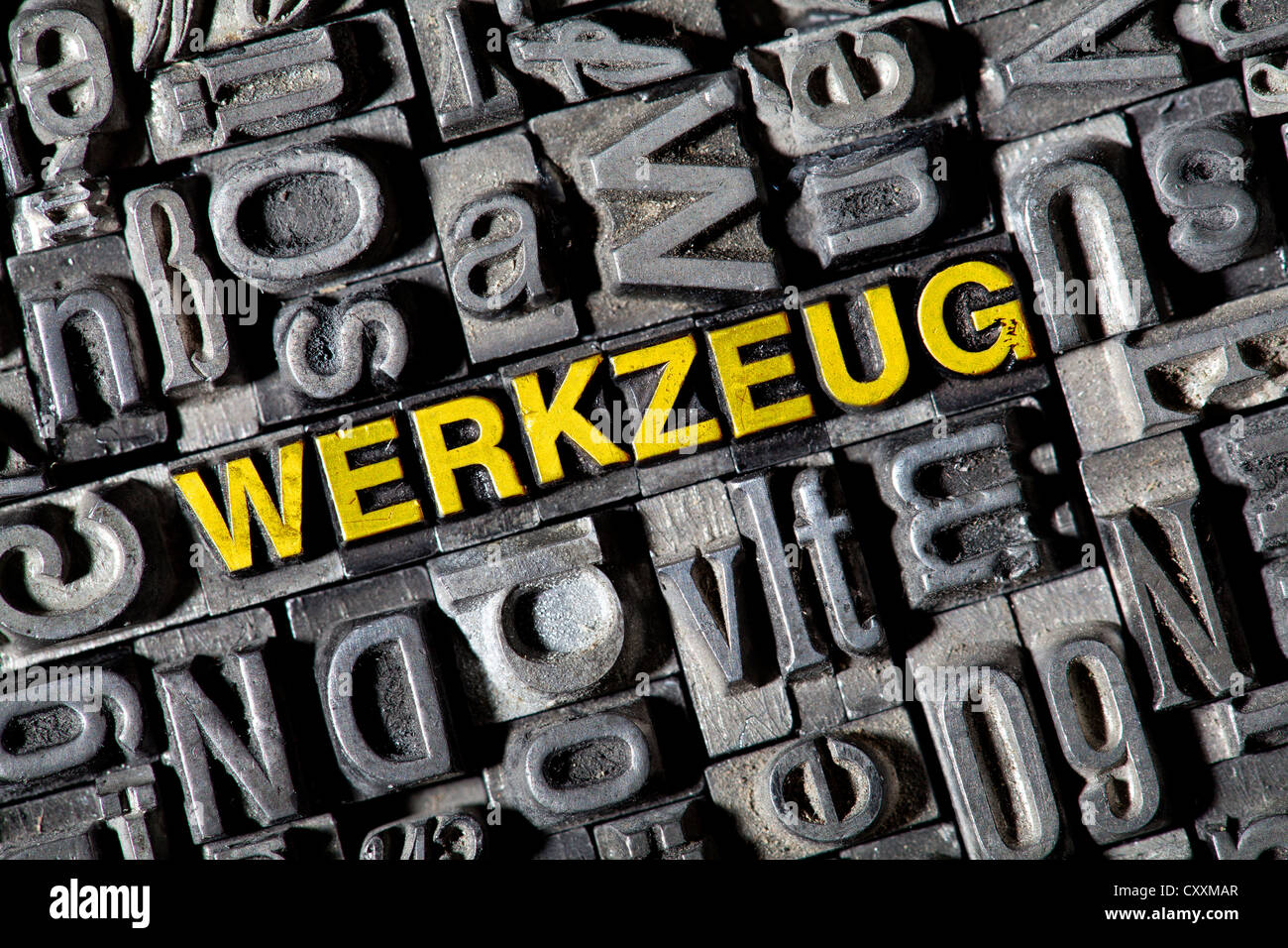 Old lead letters forming the word 'Werkzeug', German for tools Stock Photo