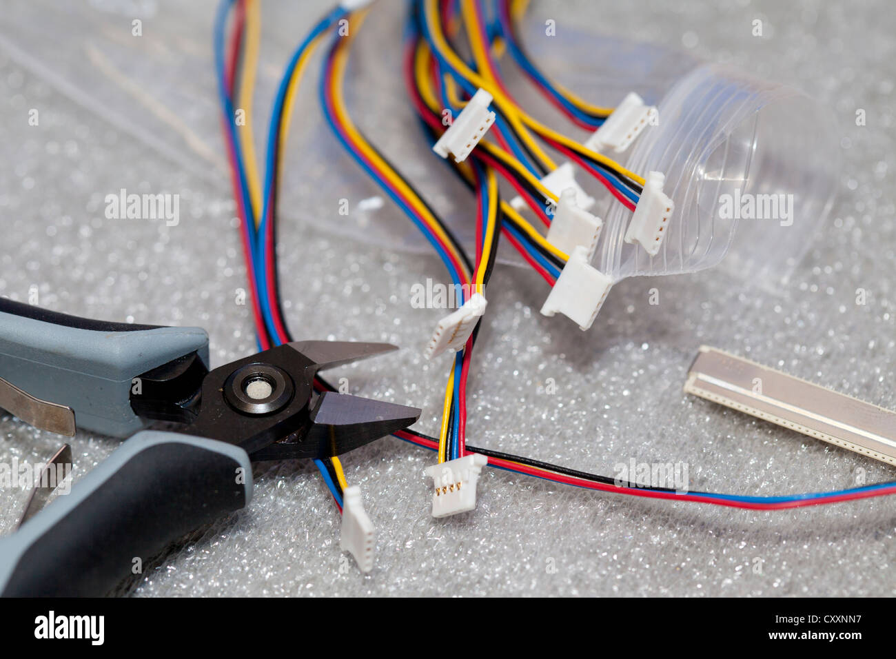 Small wires and wire cutting pliers, detailed view Stock Photo