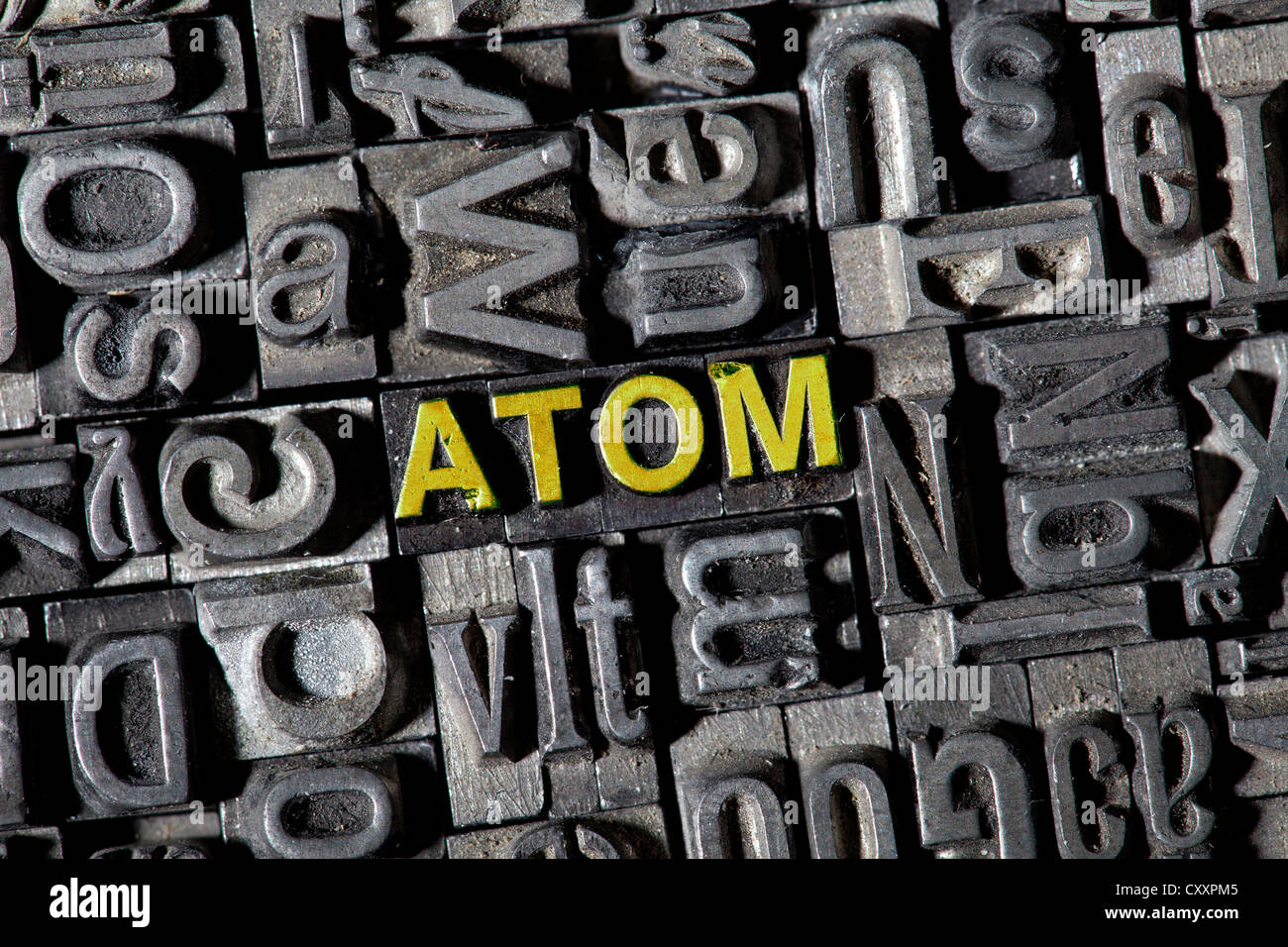 Old lead letters forming the word "ATOM Stock Photo Alamy