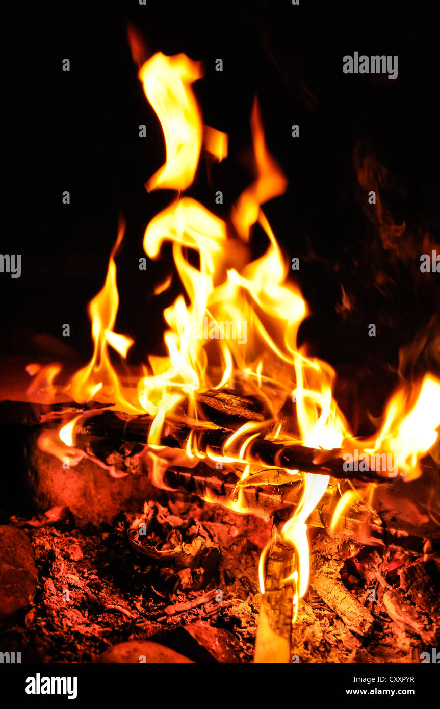 Background of flames and glowing embers in a Campfire Stock Photo