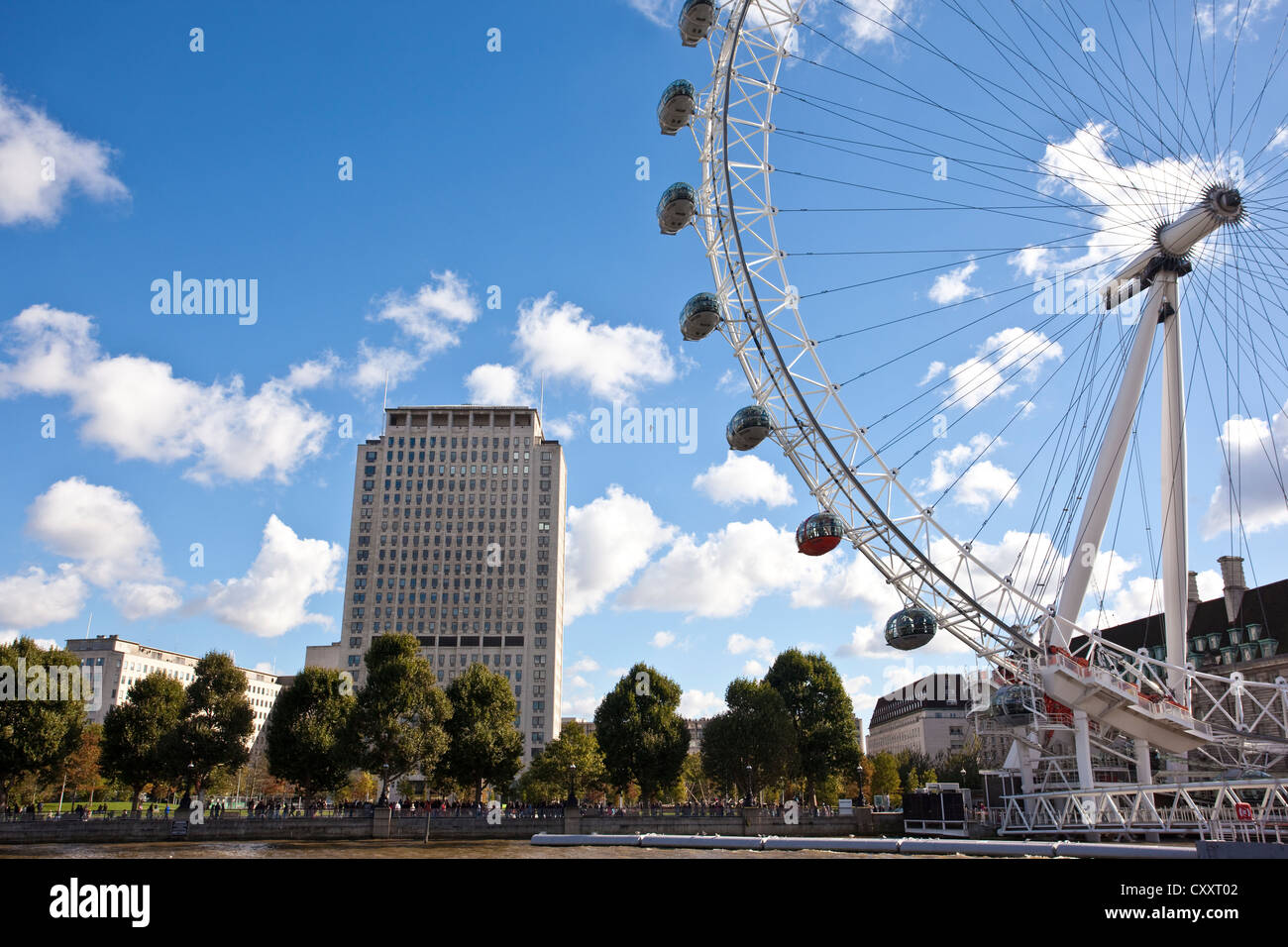 The Shell Centre building stands behind the London Eye on the Southbank of Thames River, London, England, UK Stock Photo