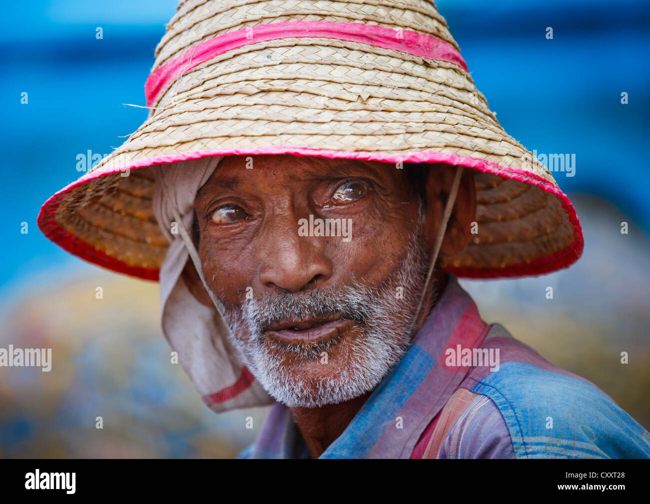 https://c8.alamy.com/comp/CXXT28/portrait-of-an-old-fisherman-wearing-a-straw-hat-mahe-india-CXXT28.jpg