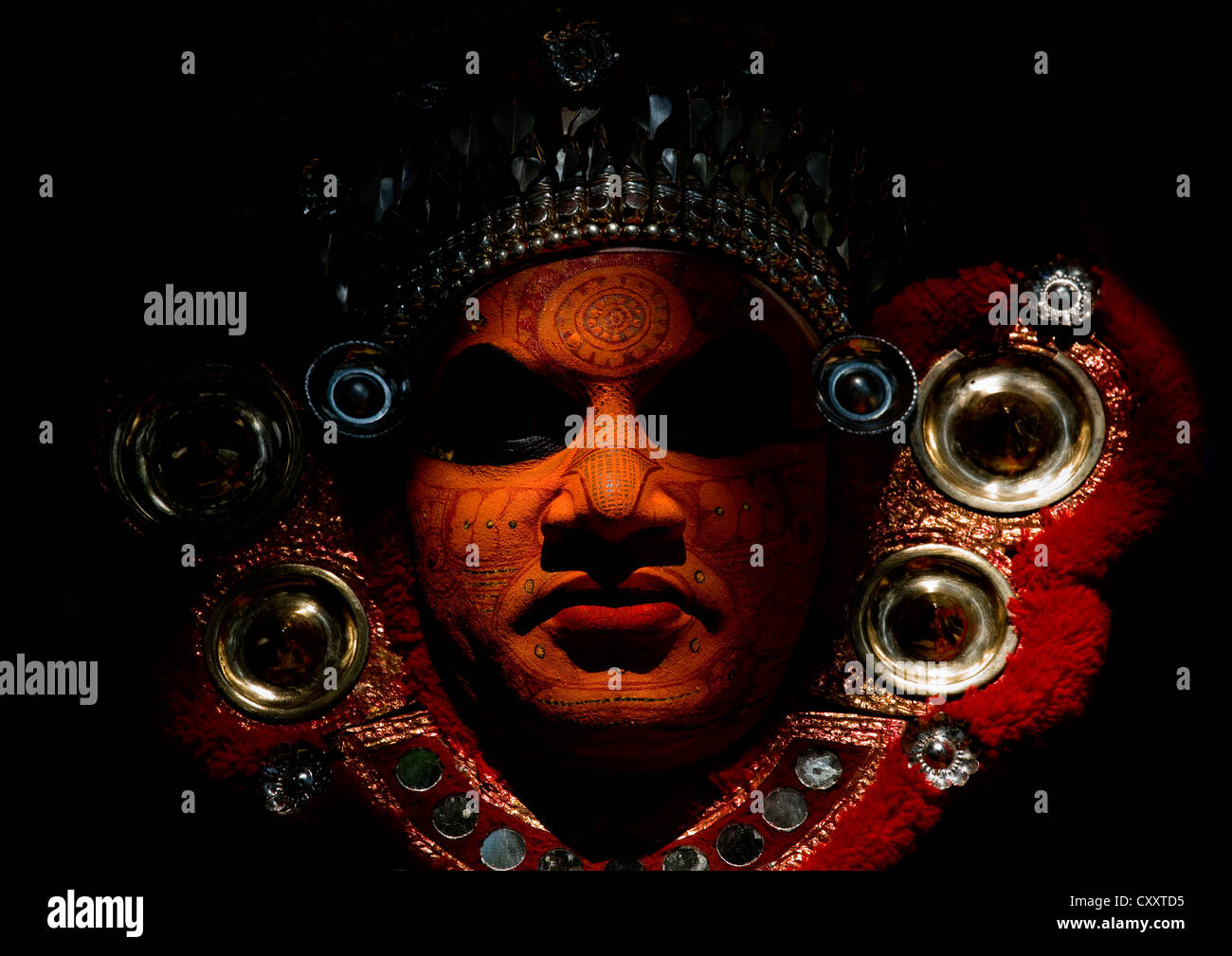 Portrait Of A Theyyam Artist With Traditional Makeup On His Face