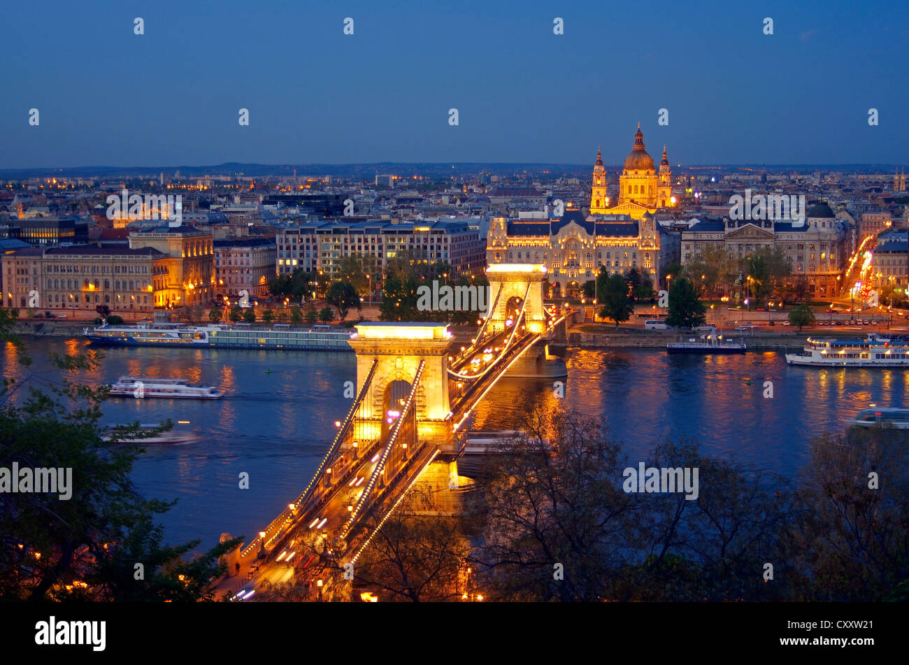 View of Budapest with the Danube at night, chain bridge, Gresham Palace, St. Stephen's Basilica, Budapest, Hungary, Europe Stock Photo