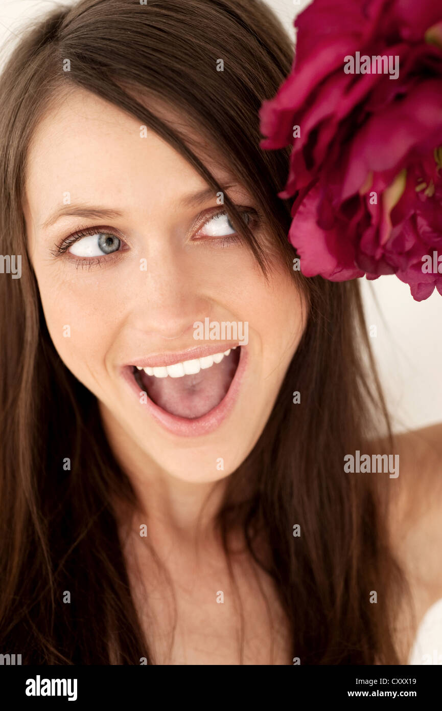 Young, beautyful woman with black and white bikini on white background