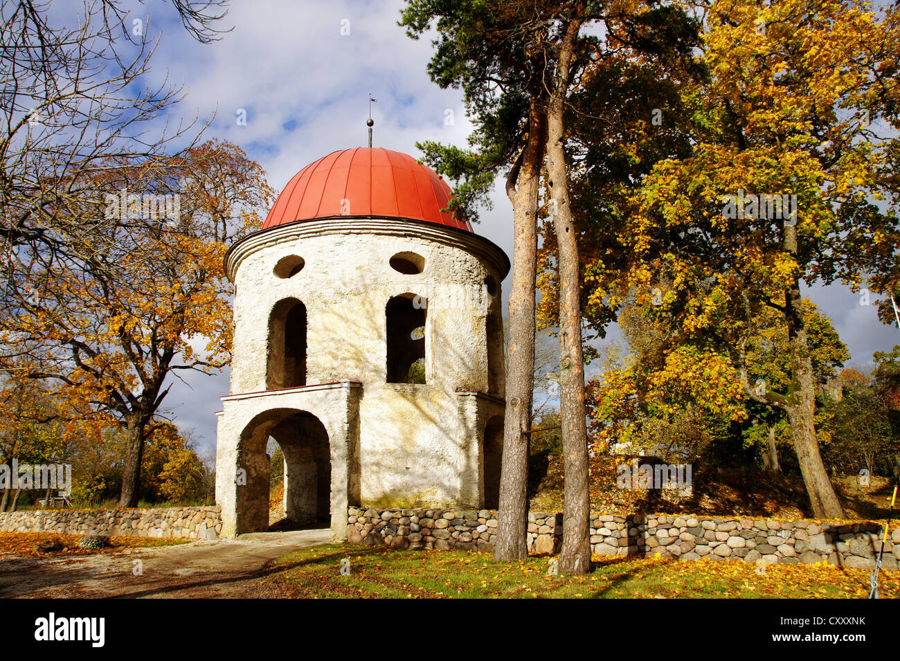 Old tower of manor on a background of autumn trees Stock Photo