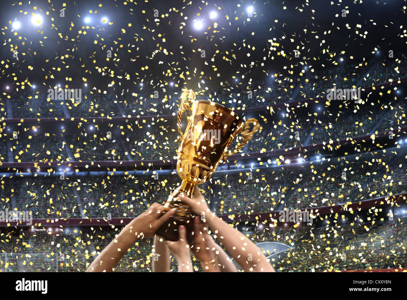 Trophy, football stadium, cheering, arms, confetti, stands Stock Photo