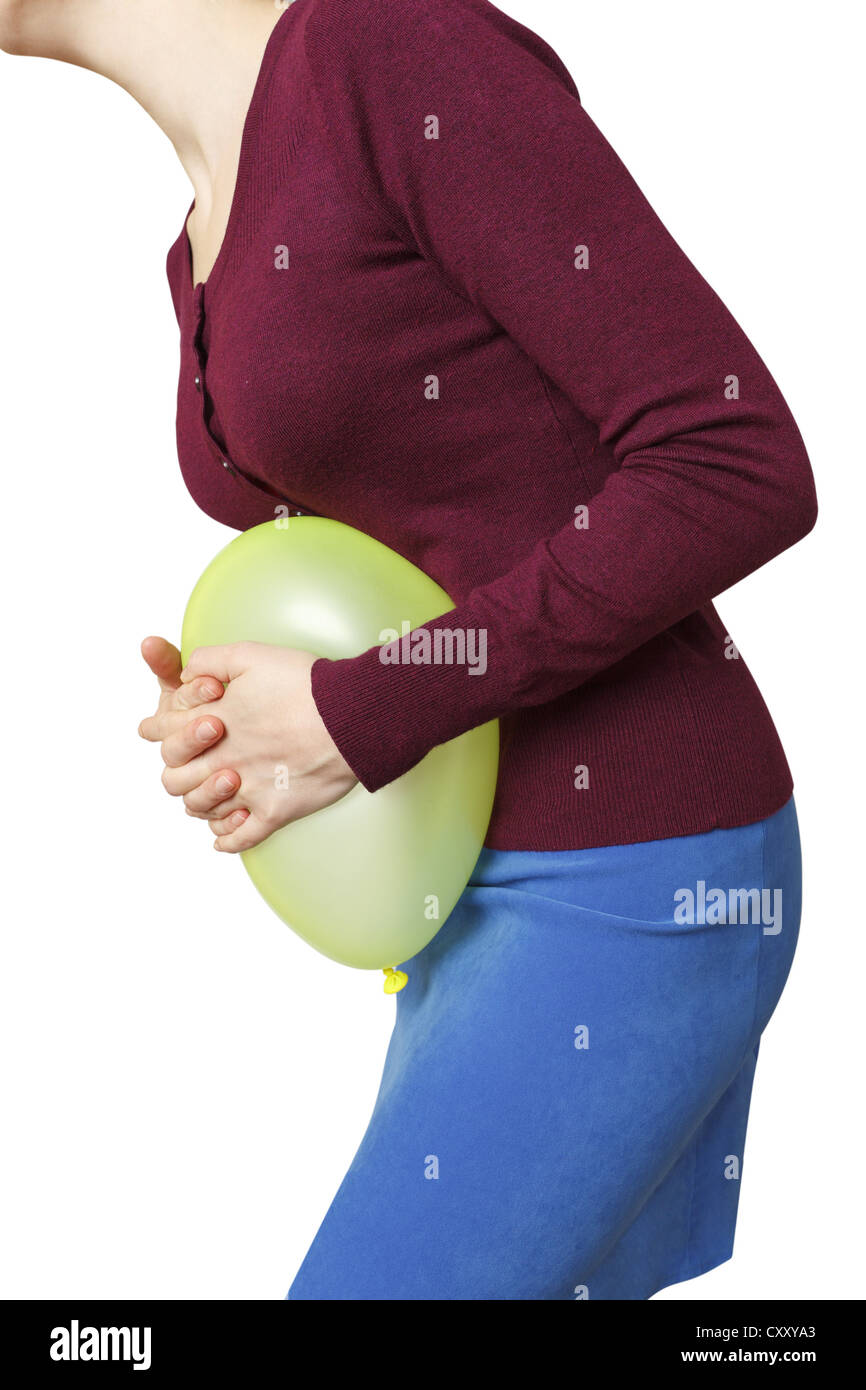 Woman pushing balloon against belly hi-res stock photography and images ...