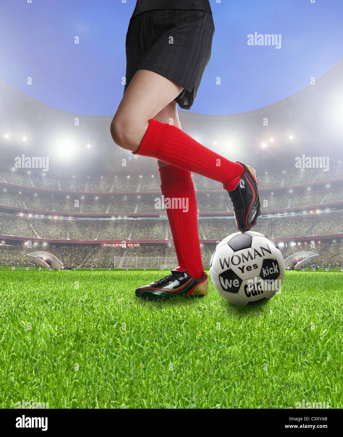 Legs of a female soccer player on a soccer ball labelled, Woman Yes we can kick, at a football stadium, illustration Stock Photo
