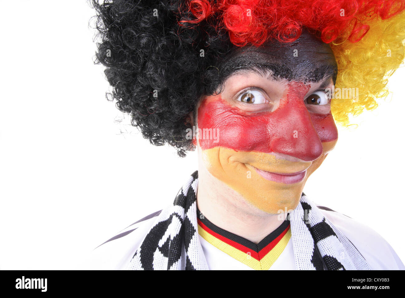 Football fan with their face painted and wearing a wig in the German national colours Stock Photo