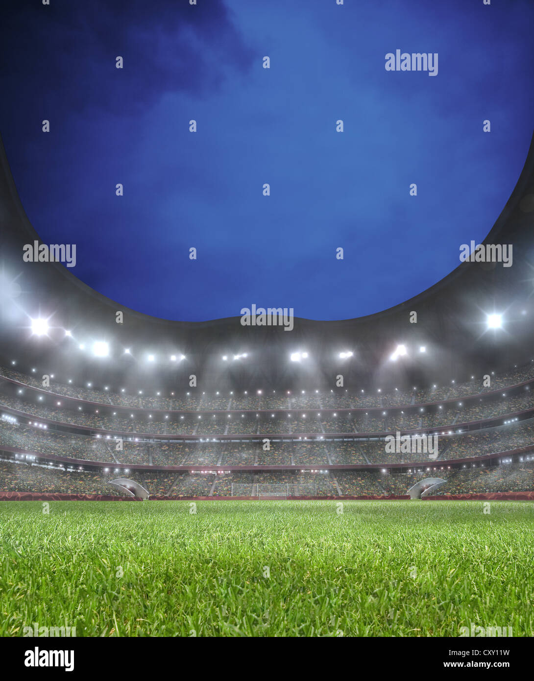 Lighted soccer stadium, lawn, grand stand Stock Photo