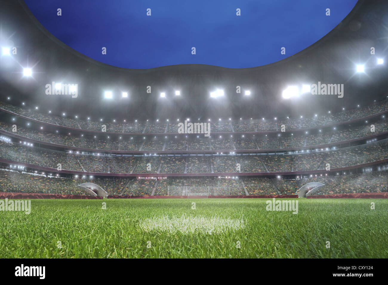 Lighted soccer stadium, lawn, spotlight, grand stand Stock Photo