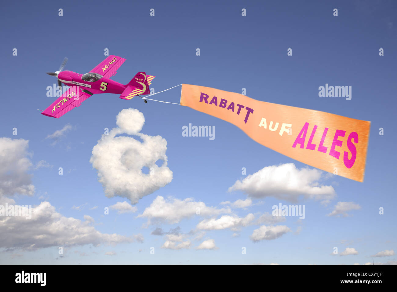 Plane in the sky pulling a banner with the message Rabatt auf alles, German for Discount on everything, illustration Stock Photo