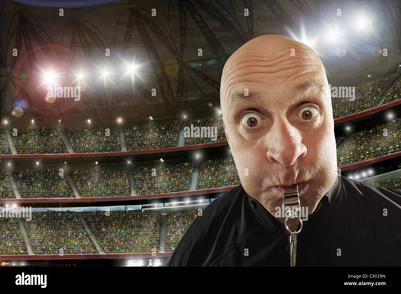 Referee with a whistle, soccer stadium Stock Photo