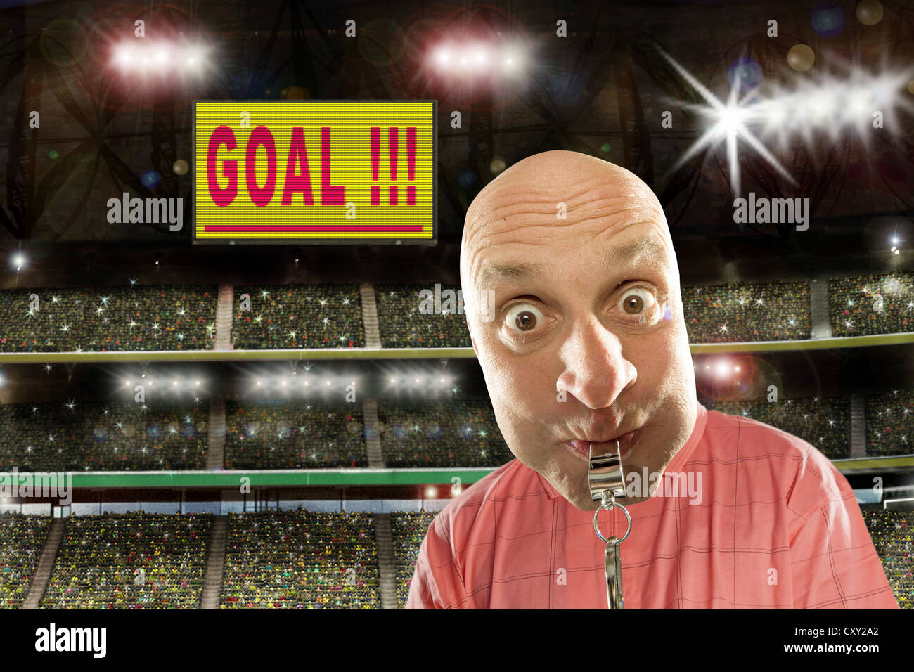 Referee with a whistle, score board, lettering 'Goal', soccer stadium Stock Photo