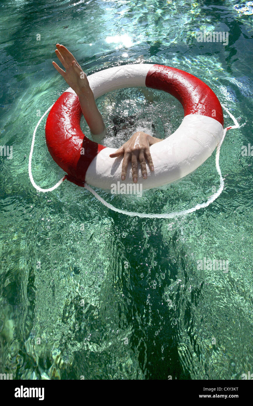 Drowning person reaching for a life ring Stock Photo Alamy
