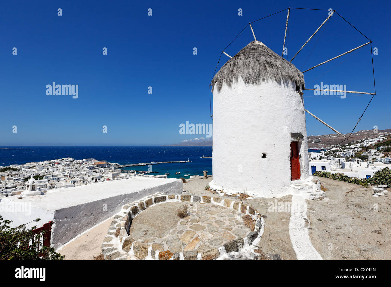 Great view at the port and Chora from a windmill of Mykonos, Greece Stock Photo