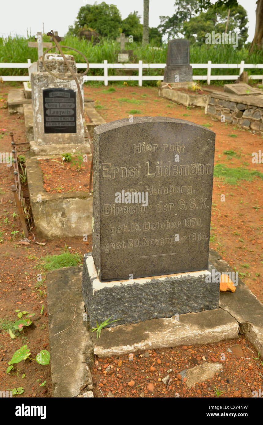 Grave stones in the German cemetery beside the Old German Church of the Catholic Pallottine Mission of Kribi, Cameroon Stock Photo
