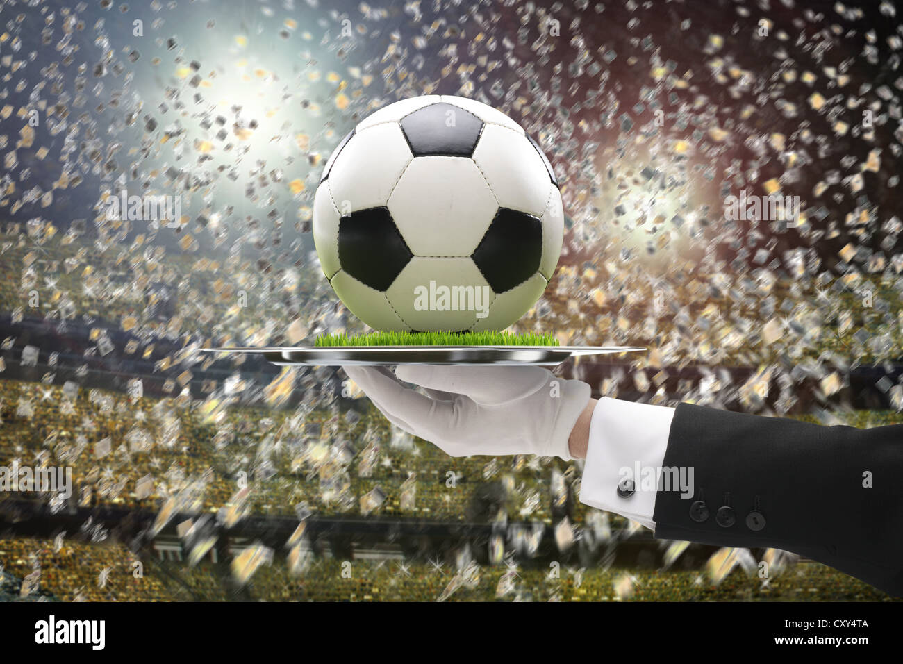 Football being served on a tray with grass, football stadium Stock Photo