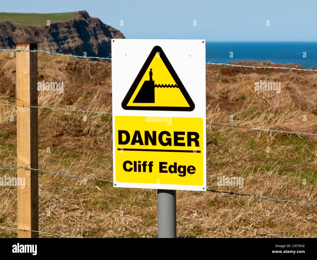 Danger Cliff Edge warning sign on the North Yorkshire Coast near Whitby England UK Stock Photo