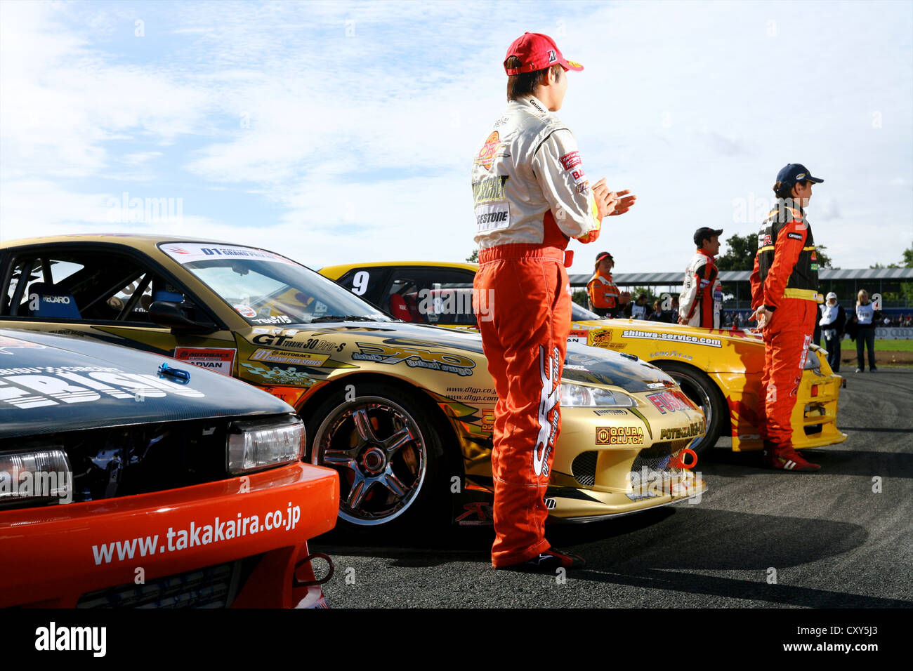 Drift cars lined up with drivers on track Stock Photo